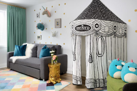 Playful kids' room with a tent-shaped nook, whimsical wall decor