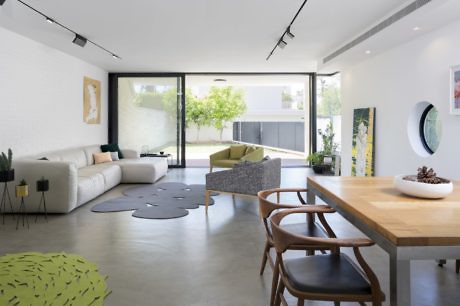 Sleek interior with minimalist decor, large windows, and open space layout.