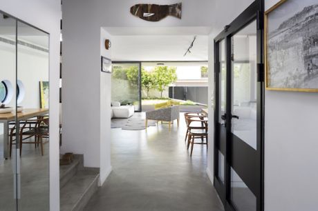 Modern home interior with open-plan design, clean lines, and minimalistic furniture.