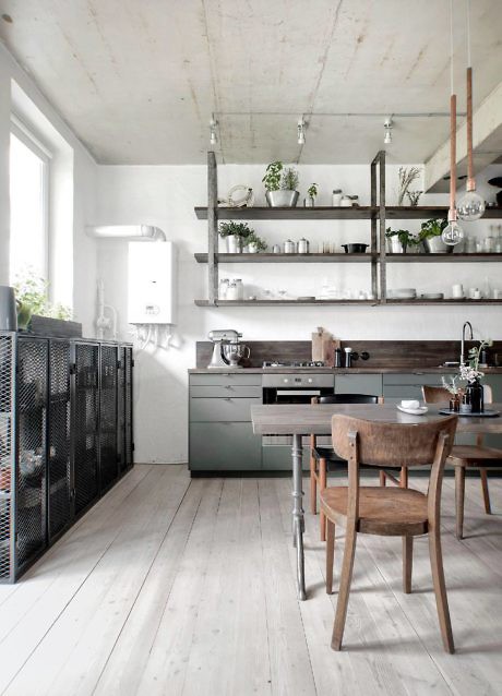 Industrial-chic kitchen with exposed concrete ceiling and open shelving.