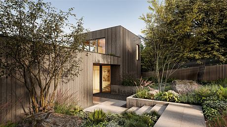 Modern wooden home with landscaped garden and concrete steps.