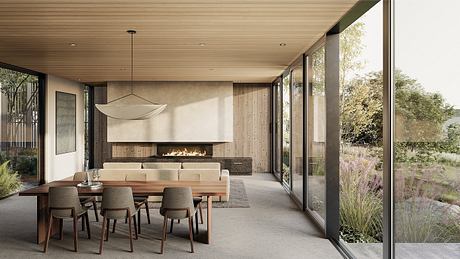 Modern dining room with fireplace and floor-to-ceiling windows overlooking nature.