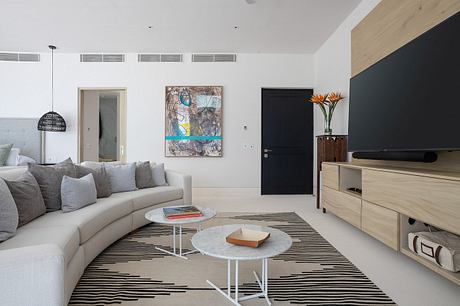 Contemporary living room with neutral tones and minimalist design.