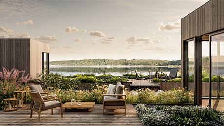 Sleek lakeside deck with stylish outdoor furniture and expansive water view.