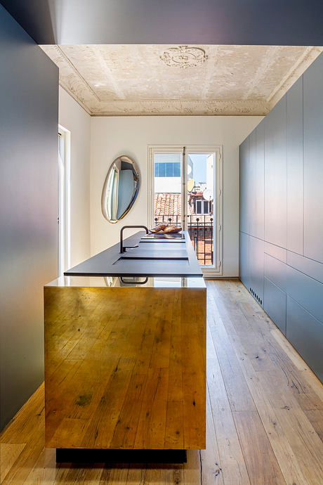 Contemporary hallway with ornate ceiling and minimalist decor.