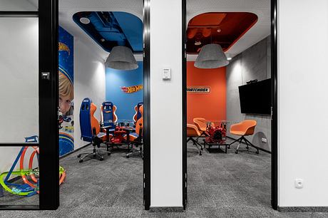 A dynamic office space with distinct Hot Wheels and Matchbox-themed zones for play and work.