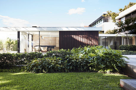 A modern architectural masterpiece with lush greenery and sleek design elements.