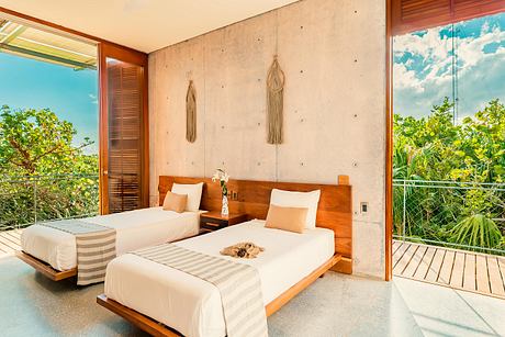 Serene tropical-themed bedroom with wooden furniture, textured walls, and expansive views.