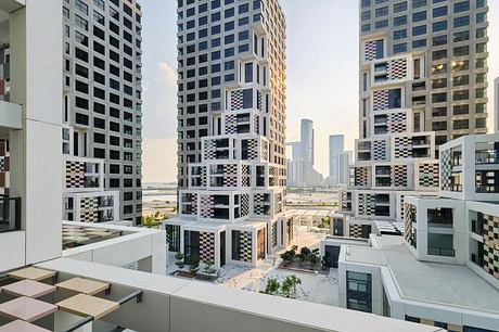 Modern high-rise buildings with bold geometric patterns and varied textures, creating an architecturally striking urban landscape.