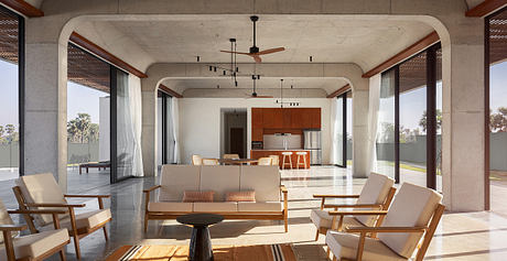 A spacious living area with concrete walls, wooden beams, and contemporary furnishings.