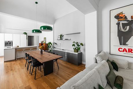 Spacious open-concept kitchen and dining area with modern decor, greenery, and vibrant accents.