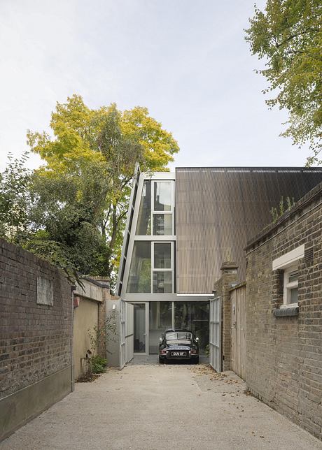 A modern glass structure contrasts with the surrounding brick walls, creating an intriguing architectural juxtaposition.