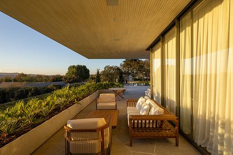 Casa Fluir is a L-Shaped House Designed Around a Shared Central Courtyard - 5
