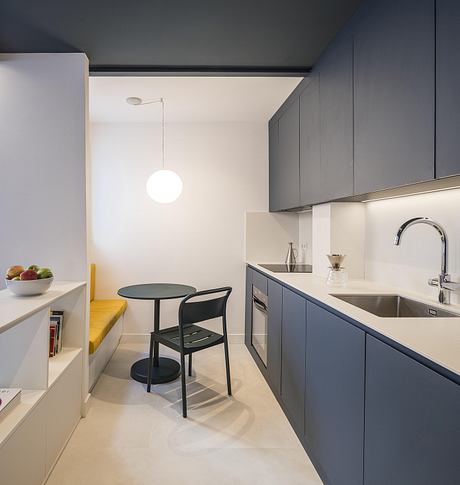 Casa Binôme: Reimagining a Madrid Duplex Around a Living Stair Core - 5