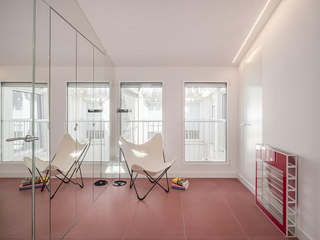 Casa Binôme: Reimagining a Madrid Duplex Around a Living Stair Core - 6