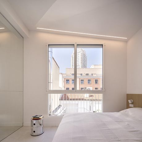 Casa Binôme: Reimagining a Madrid Duplex Around a Living Stair Core - 8