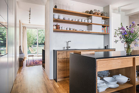 Home Again Reframes a 1950s House into a Warm Social Haven in Prague - 3