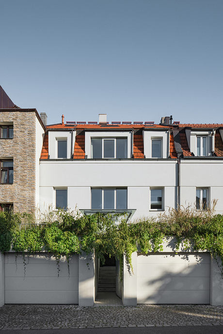 Home Again Reframes a 1950s House into a Warm Social Haven in Prague - 11