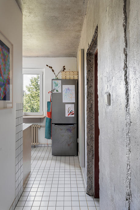 Painters’ Apartment Reworks a Panel Flat with Art and Plywood Details - 3