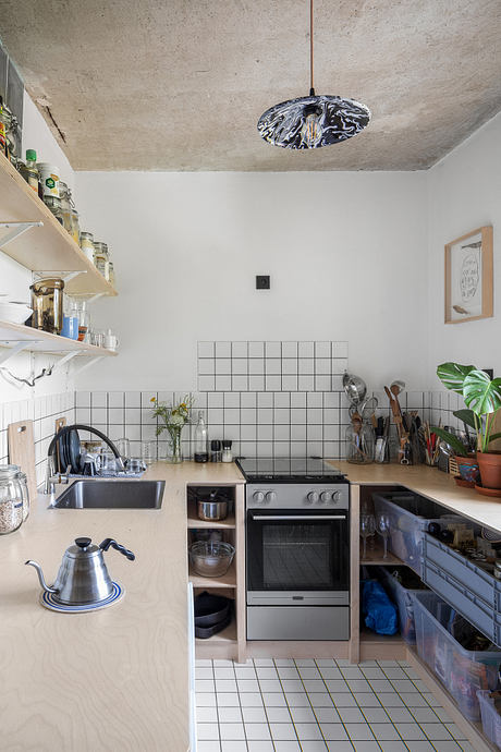 Painters’ Apartment Reworks a Panel Flat with Art and Plywood Details - 4