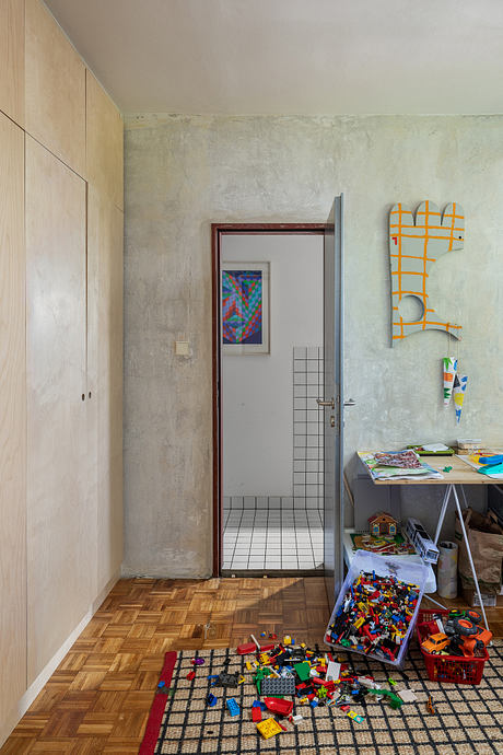 Painters’ Apartment Reworks a Panel Flat with Art and Plywood Details - 6