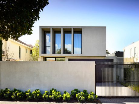 Contemporary exterior with clean lines, large windows, and landscaped grounds.