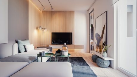 A modern, minimalist living room with wood-paneled walls, built-in TV unit, and glass coffee tables.