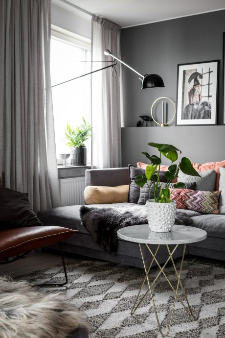 Cozy living room with plush furnishings, warm lighting, and elegant decor accents.