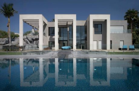 Expansive modern villa with a sleek, minimalist design and a stunning infinity pool.