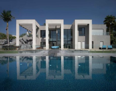 Expansive modern villa with a sleek, minimalist design and a stunning infinity pool.