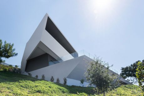 Striking modern architecture with angular concrete forms and glass accents.