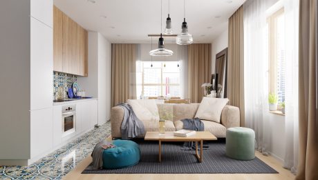 Cozy living room with minimalist furniture, warm lighting, and patterned floor rug.