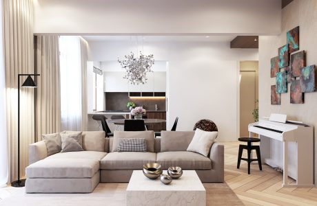 Spacious, modern living room with sleek furniture, custom artwork, and a striking crystal chandelier.