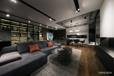 Stylish open-concept living space with sleek modern furniture, industrial-inspired decor.