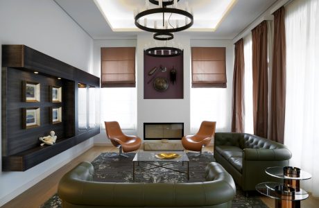 Sophisticated living room with sleek furniture, modern lighting, and elegant decor.