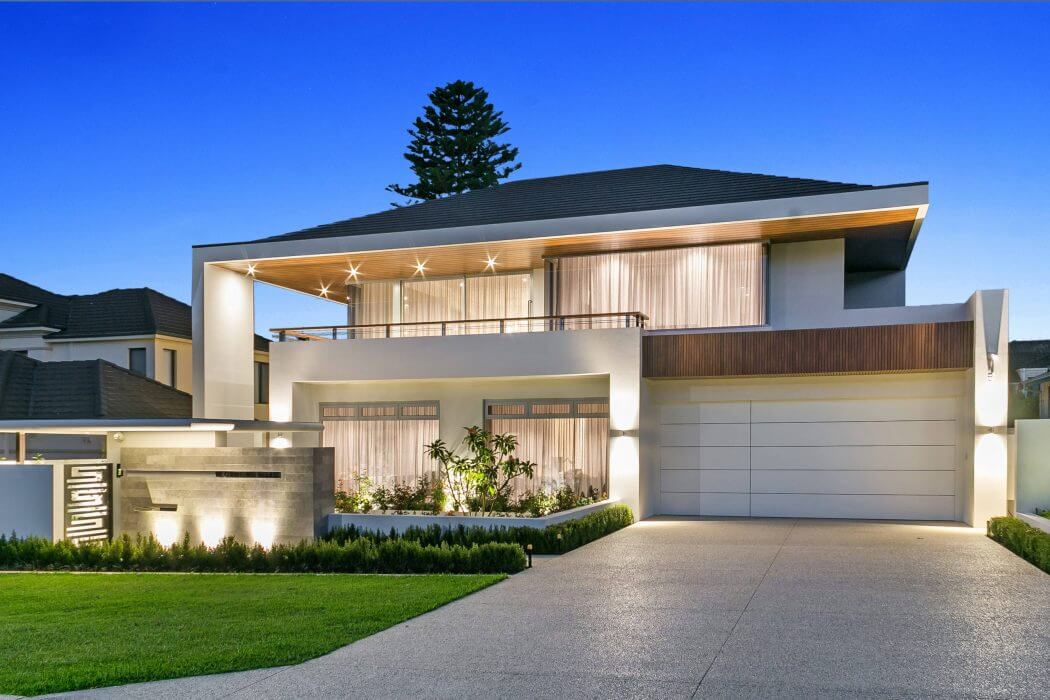 Sleek, modern home with clean lines, wood accents, and a well-landscaped exterior.