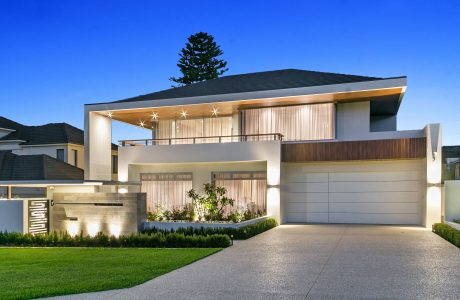 Sleek, modern home with clean lines, wood accents, and a well-landscaped exterior.