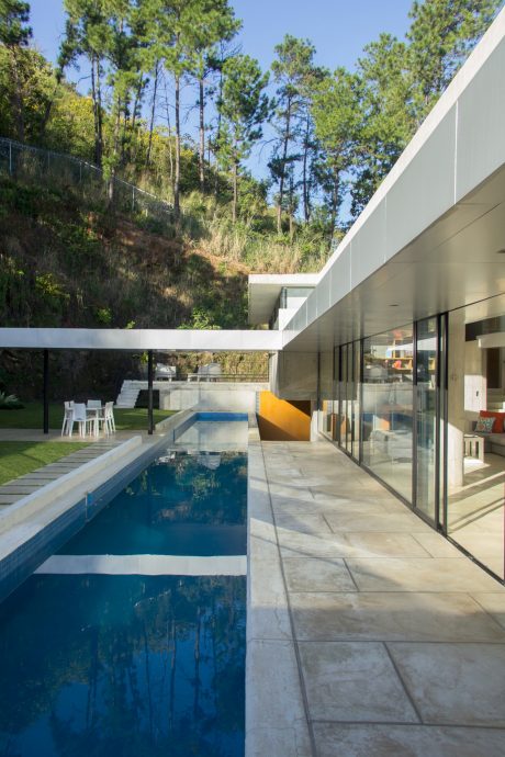 A contemporary home with a sleek, minimalist design and an inviting outdoor pool.