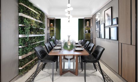 An elegant dining room with a vertical garden wall, minimalist decor, and modern furnishings.