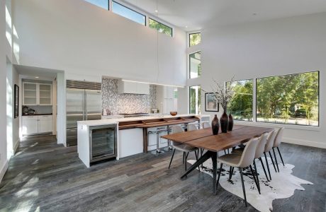 Spacious open-plan kitchen and dining area with modern appliances and natural lighting.