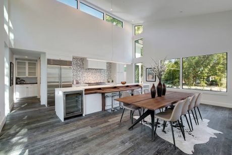 Spacious open-plan kitchen and dining area with modern appliances and natural lighting.