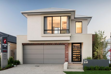 Contemporary two-story suburban home with modern architectural features, large windows, and garage door.