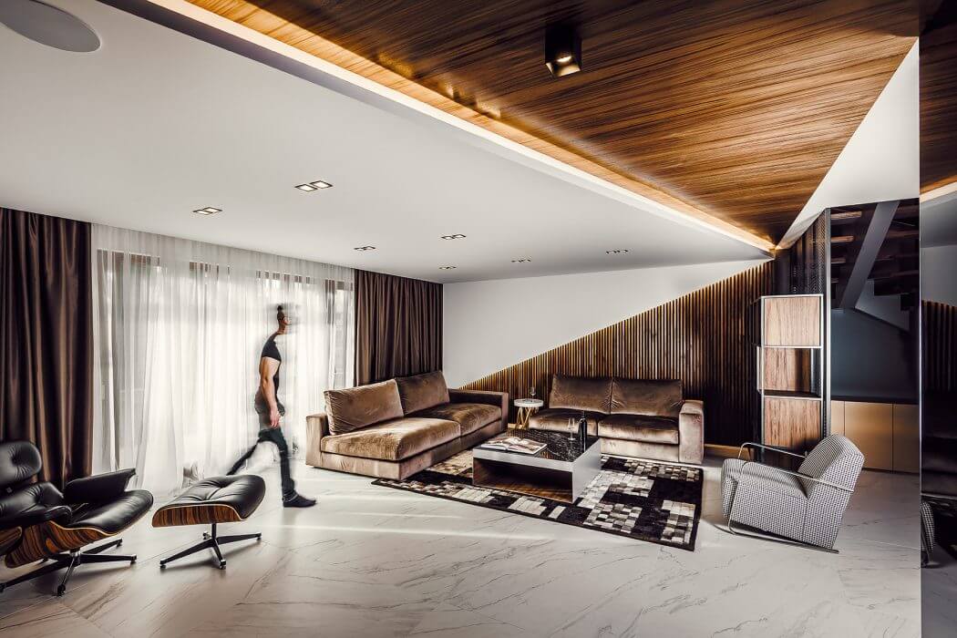 A modern, luxurious living room with sleek wooden paneling, plush sofas, and a chic, minimalist design.