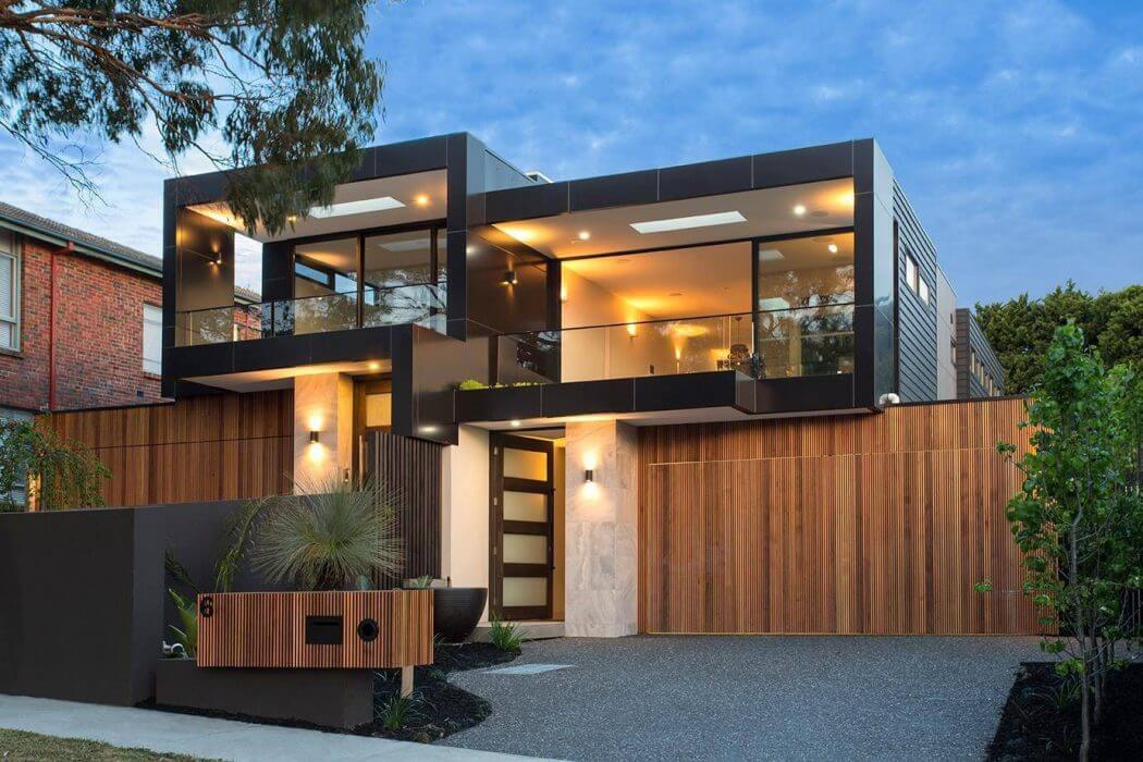 Sleek, modern home with glass walls, wooden accents, and a stunning exterior design.