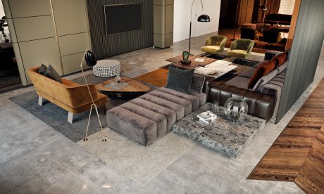 Luxurious living room with sleek furniture, stone coffee table, and warm wood floors.