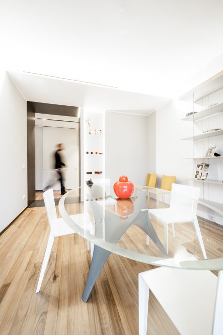 Contemporary open-plan living space with minimalist furniture and modern decor.