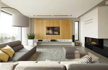 Elegant modern living room with wooden media unit, fireplace, and neutral furnishings.