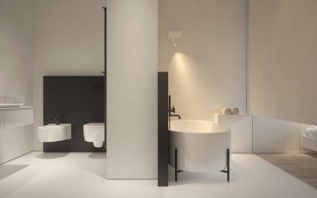 Minimalist bathroom design featuring monochrome color palette, modern fixtures, and clean lines.