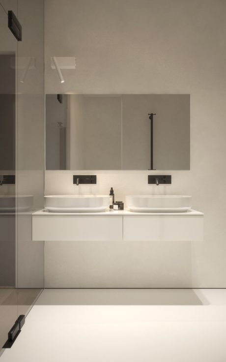 Modern, minimalist bathroom with sleek vanity, twin sinks, and recessed lighting.