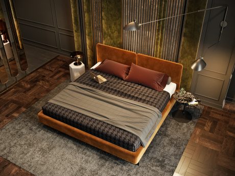 Elegant contemporary bedroom with plush orange upholstered headboard, sleek lamps, and patterned bedding.